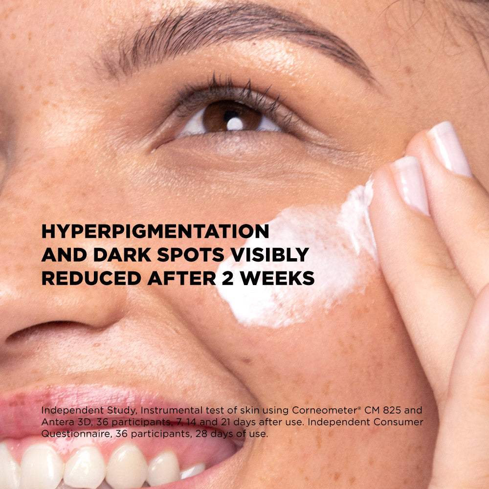 Close-up of a person applying a skincare product with text about hyperpigmentation reduction.