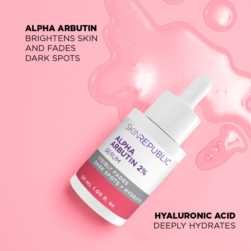 Skin Republic Alpha Arbutin serum bottle on a pink background with text about its benefits.