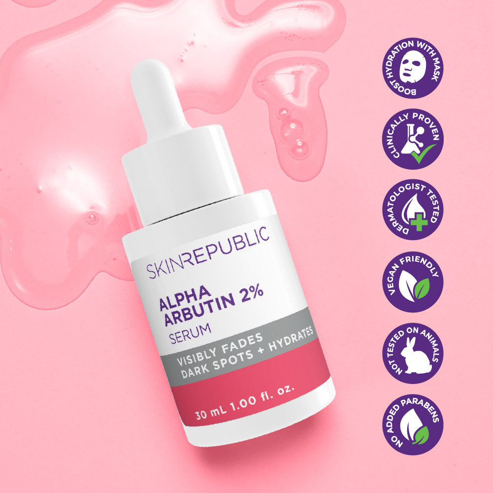 Skin Republic Alpha Arbutin 2% Serum bottle on a pink background with brand icons.