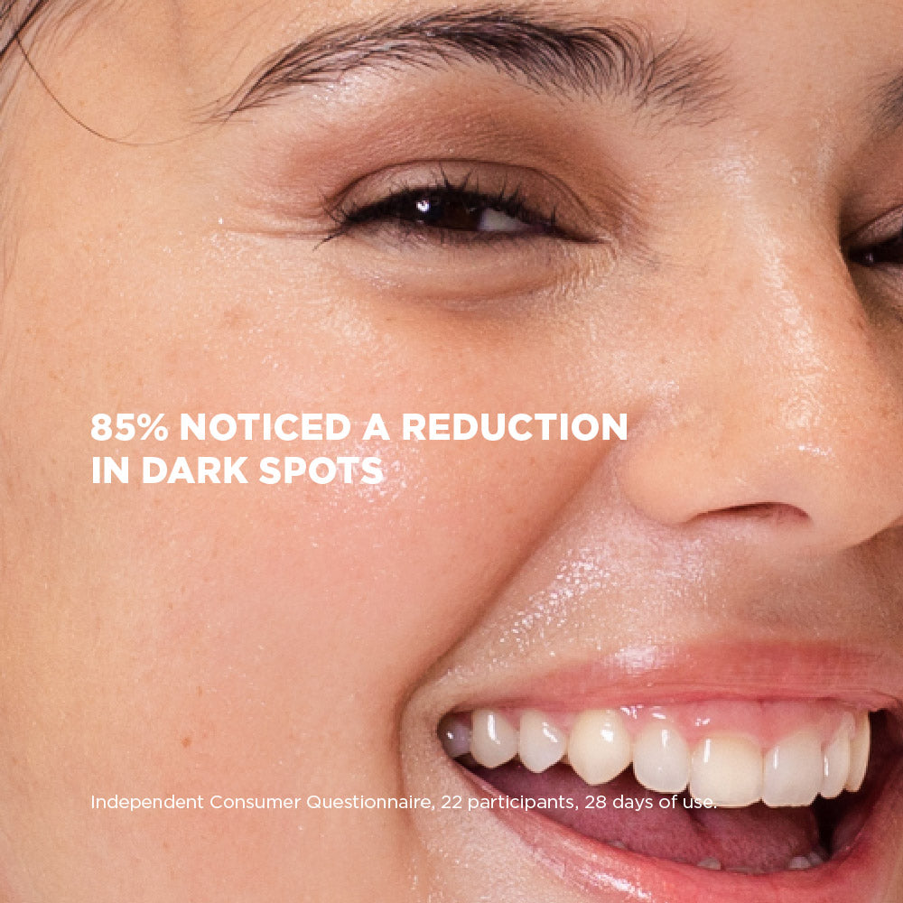 Close-up of a person's face with text indicating a reduction in dark spots.
